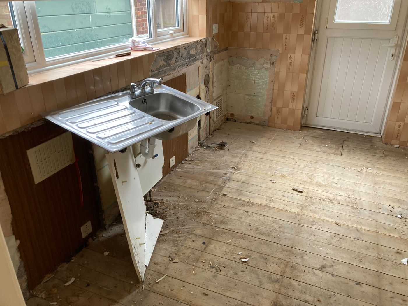 After: Kitchen strip-out: old units removed and taken away